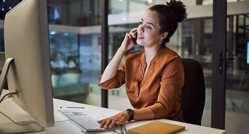 Phone call, communication and networking with a business woman working on a computer